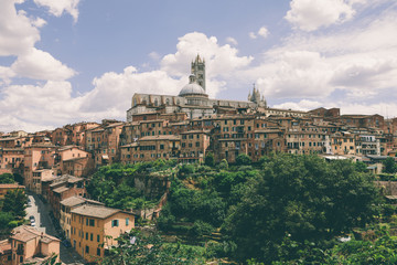 Fototapeta na wymiar Panoramic view of Siena city with historic buildings and street