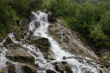 Obraz premium Closeup view waterfall scene in mountains, national park of Dombay, Caucasus