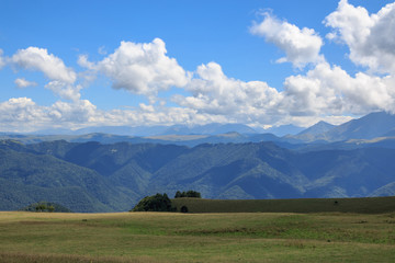Closeup view mountains and valley scenes in national park Dombai, Caucasus