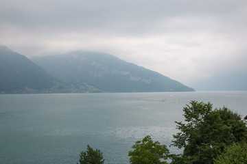 View on lake Thun and mountains from ship in city Spiez, Switzerland