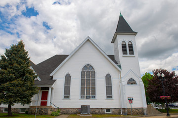 New Hope Fellowship Church on Main Street in Maynard historic town center in summer, Maynard, Massachusetts, USA.
