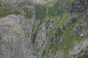 Closeup mountains scenes, walk to Trift Bridge in national park Switzerland