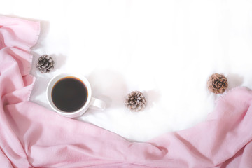 Christmas composition. Cup of coffee, scarf on pink background. Christmas, winter concept. Flat lay, top view, copy space