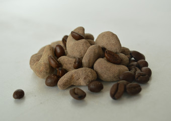 roasted coffee beans with cashew on white background
