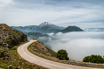 Mountain road with a view of the Dirfi moutain peak in the Euboea island in Greece while the fog...