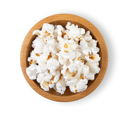 Popcorn in wooden cup bowl on white background top view