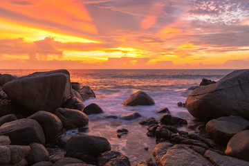 Fototapeta na wymiar panorama sunset at Laem Sai cape. Many small and large stones surround Laem Sai cape from Karon Beach to Kata Beach..