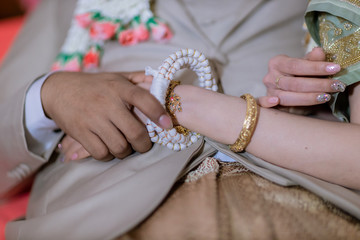 Man and woman holding hands in wedding ceremony . bride and groom holding hand in wedding ceremony.