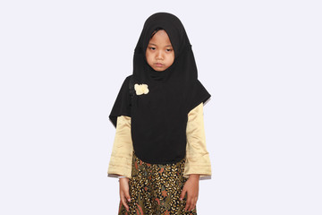 Portrait of cute A  young asian little girl 6-7 years old muslim, wearing hijab, show face  expression