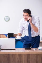 Young male businessman working in the office