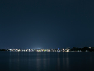 Fototapeta na wymiar View of Kingston Foreshore at night looking over Lake Burley Griffin in Canberra, the capital city of Australia