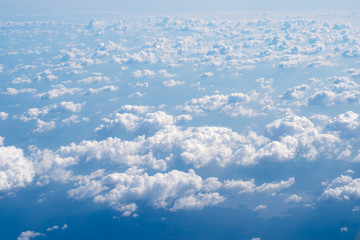Beautiful cloudscape of blue sky and fluffy white clouds nature background,  View from airplane.