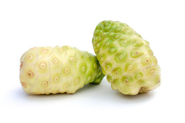 Closeup two fresh raw and ripe Noni fruits or Morinda citrifolia (cheese fruit, great indian mulberry ) isolated on white background.