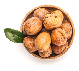 Bowl with tasty walnuts on white background