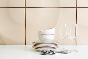 Set of clean dishware on table