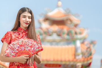 Beautiful woman Asian wearing red dress in Chinese New Year
