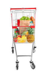 Shopping cart with products on white background