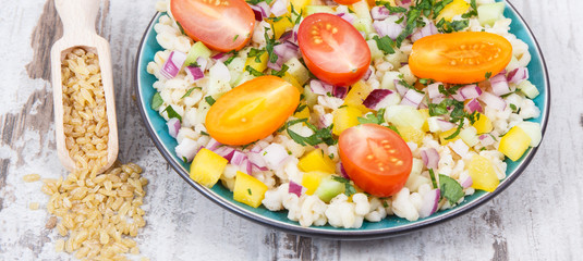 Salad with bulgur groats and vegetables as best food for dieting and slimming