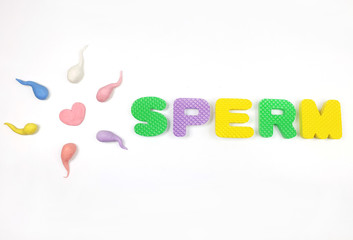 Active sperm cells swim to the egg on a white background. The concept of pregnancy, fertilization of the egg