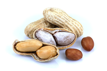 Peeled and unpeeled peanut or goober isolated on white background. Healthy food concept. 