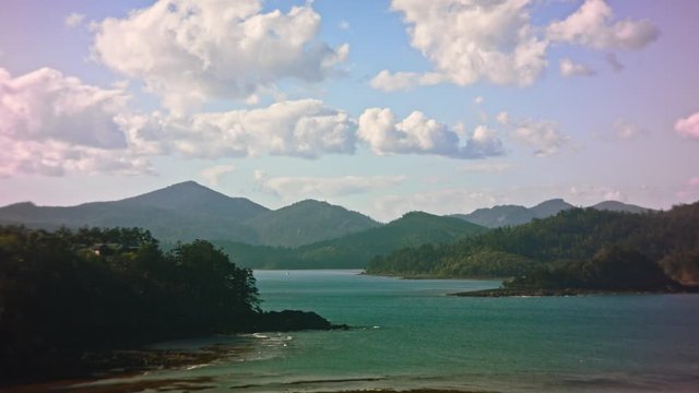 Yachts sailing between tropical islands time lapse