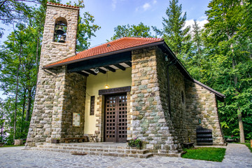 Fototapeta na wymiar Small Church in the Forest: Chapel of Our Lady of Sljeme, Queen of Croats (Sljeme Chapel) - Highest Parish Church in Croatia - Medvenica Mountain, Zagreb, Croatia 