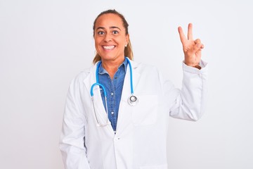 Fototapeta premium Middle age mature doctor woman wearing stethoscope over isolated background showing and pointing up with fingers number two while smiling confident and happy.