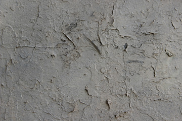 Texture of old plasterwork covered with peeled paint
