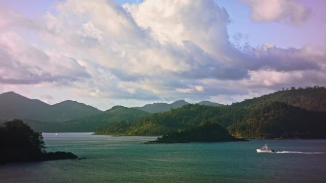 Time lapse over tropical island with clouds