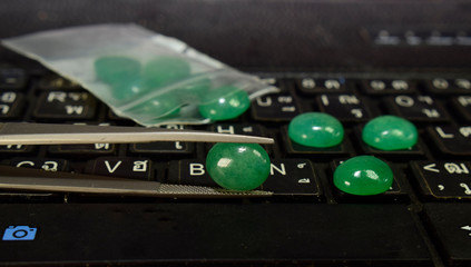  A collection of various tumbled green jade mineral stones (nephrite and jadeite