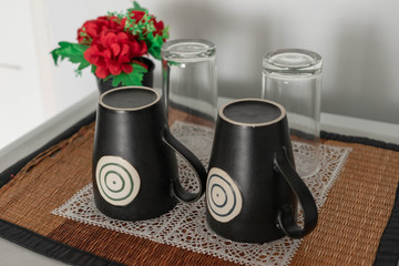 black cup and the glass of water