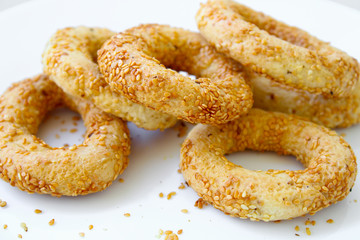 small sesame bagels on plate