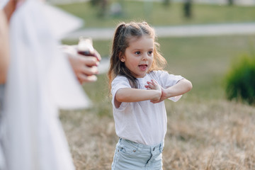 little girl having fun at picnic, pizza, drinks, summer and lawn