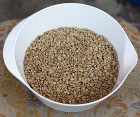 Bowl of green (unroasted) coffee beans
