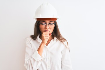 Young beautiful architect woman wearing helmet and glasses over isolated white background feeling unwell and coughing as symptom for cold or bronchitis. Healthcare concept.