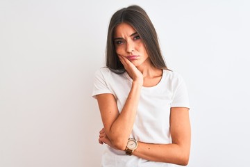 Young beautiful woman wearing casual t-shirt standing over isolated white background thinking...