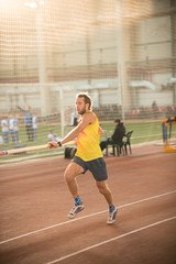 Obraz premium Pole vaulting in the sports stadium - an athletic man running on the track
