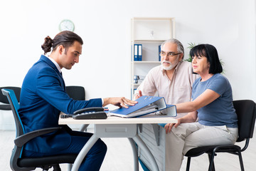 Financial advisor giving retirement advice to old couple