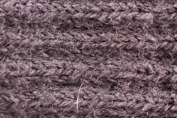 Photo gray fabric close-up (macro), shows a large knit sweater