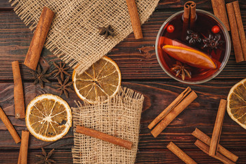Christmas composition with  hot mulled wine in rustic cup