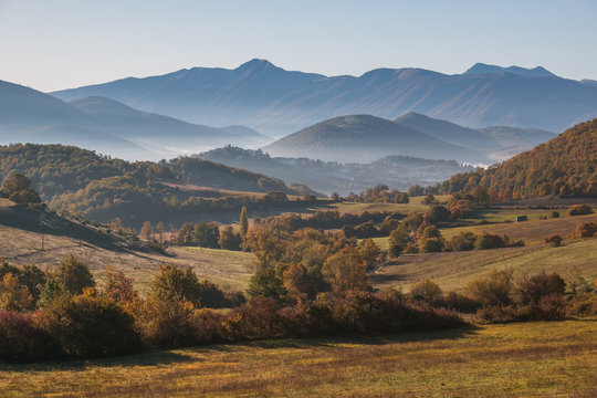 Morning view of Monteleone di Spoleto medieval village with fog on autumn day