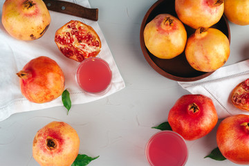 Ripe pomegranates on a light gray kitchen table