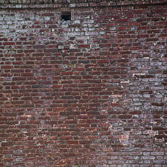 Red vintage brick wall with decay surface