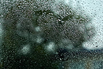 Drops on the glass, the sky. abstraction background.