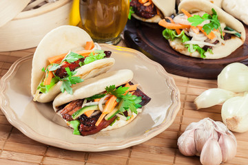 Gua bao, steamed buns with pork belly and vegetable