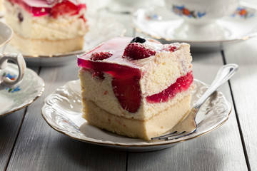 Cheesecake with strawberries, blueberry and jelly