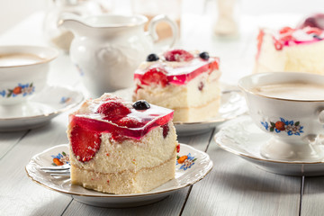 Cheesecake with strawberries, blueberry and jelly