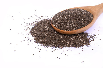 Chia seeds ( Salvia hispanica ) in wooden spoon isolated on white background. Healthy food , superfood and supplement concept. Selective focus.