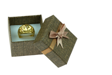 Open gift box ,A large gold ring inside,on the white background.