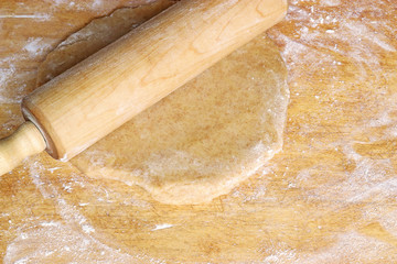 rolling out dough with a rolling pin